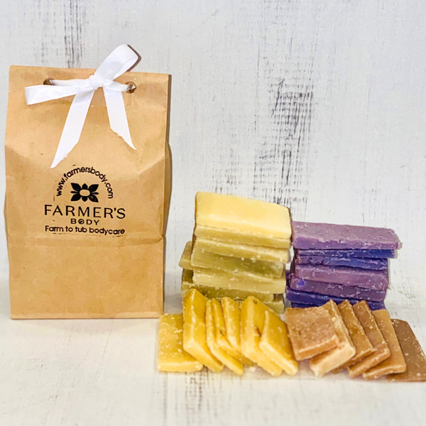 small guest soaps in a paper bag with a bow